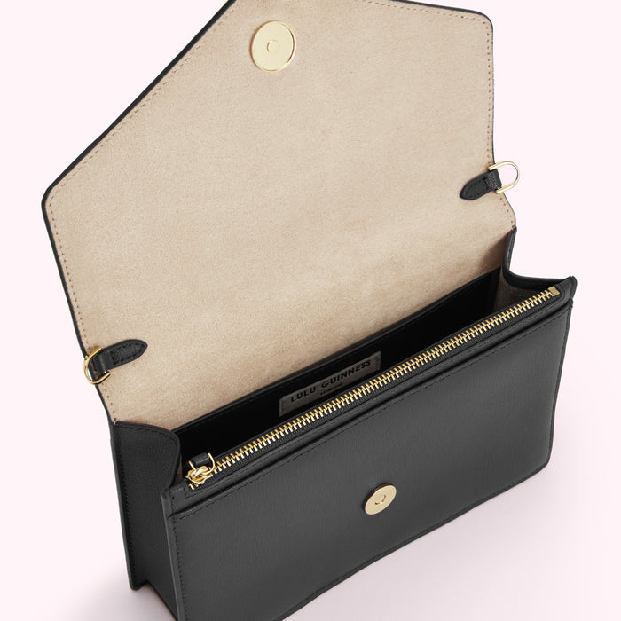 Open black Lulu Guinness crossbody bag with beige interior.