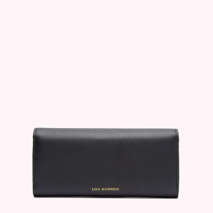 Black Lulu Guinness wallet against a white background.