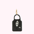 Black tuxedo keychain against a white background.