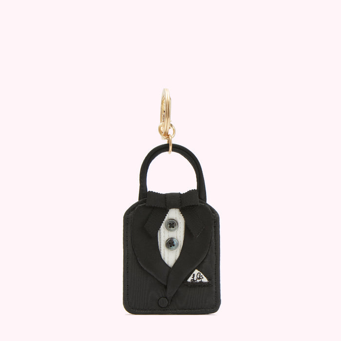 Black tuxedo keychain against a white background.
