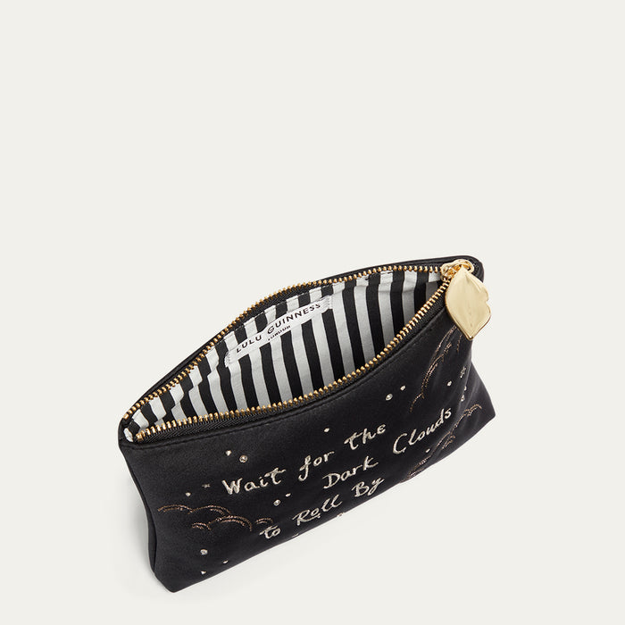 Black satin pouch with gold text and a striped interior on a white background