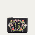 Front image of a black canvas pouch with pastel floral embroidered detail and embroidered L.G. monogram.
