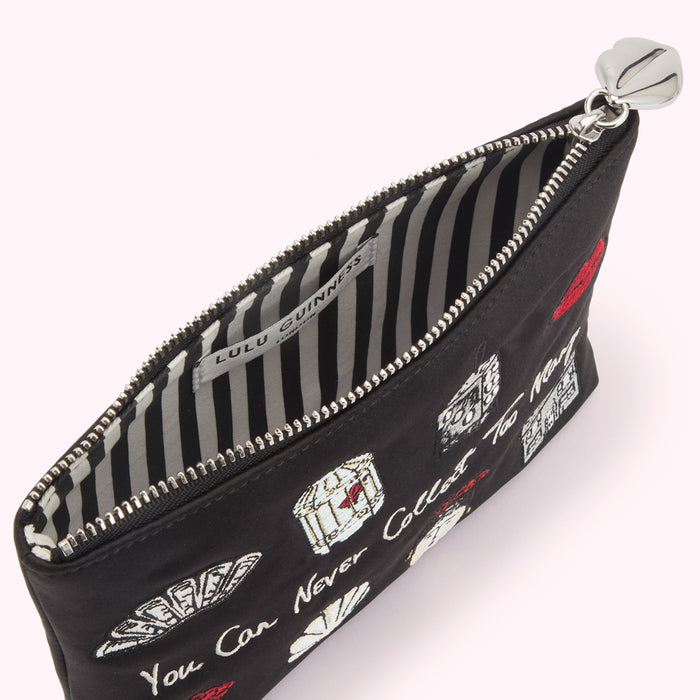 Black Lulu Guinness pouch open to reveal black and white striped interior, embroidered with images and text.