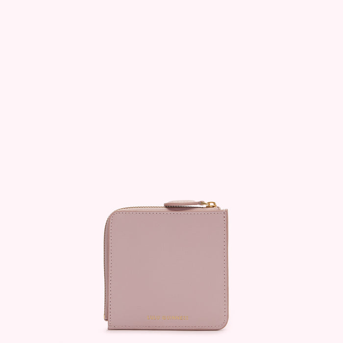Dusty rose zip-around wallet by Lulu Guinness on white background.