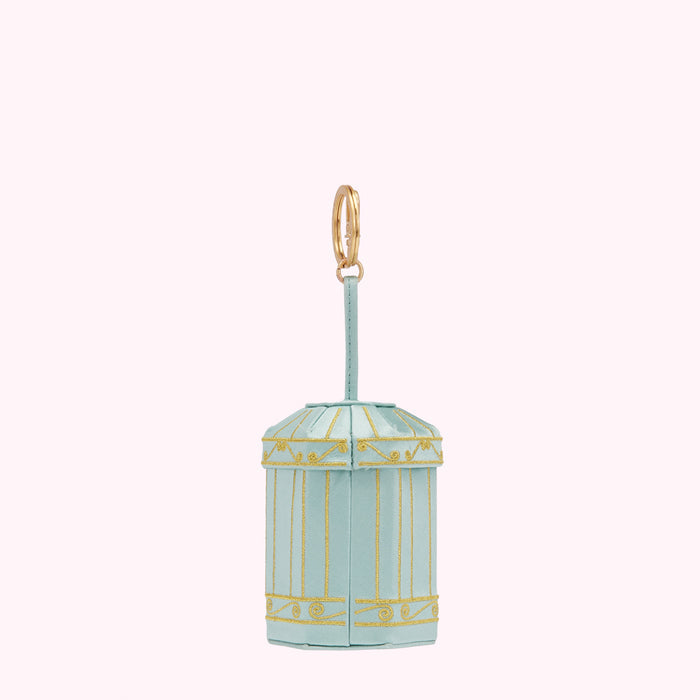 Light blue birdcage-shaped keychain with gold accents against a white background.