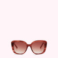 Brown and pink sunglasses with a gradient brown lens against a white background.