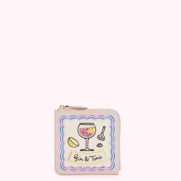 Pale pink leather zip-around wallet with embroidered gin and tonic design.