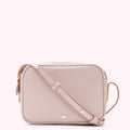Pink Lulu Guinness crossbody bag.