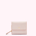 A pale pink leather wallet with a gold lip-shaped accent.