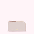 Pale pink leather zip-around cardholder with gold zipper and hardware.