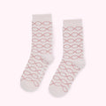 Pair of pink socks with a rose gold lip pattern.