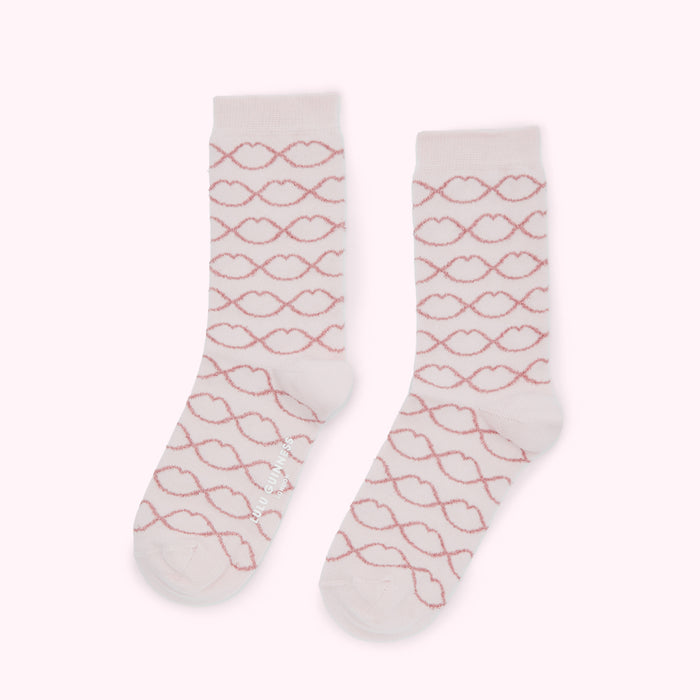 Pair of pink socks with a rose gold lip pattern.