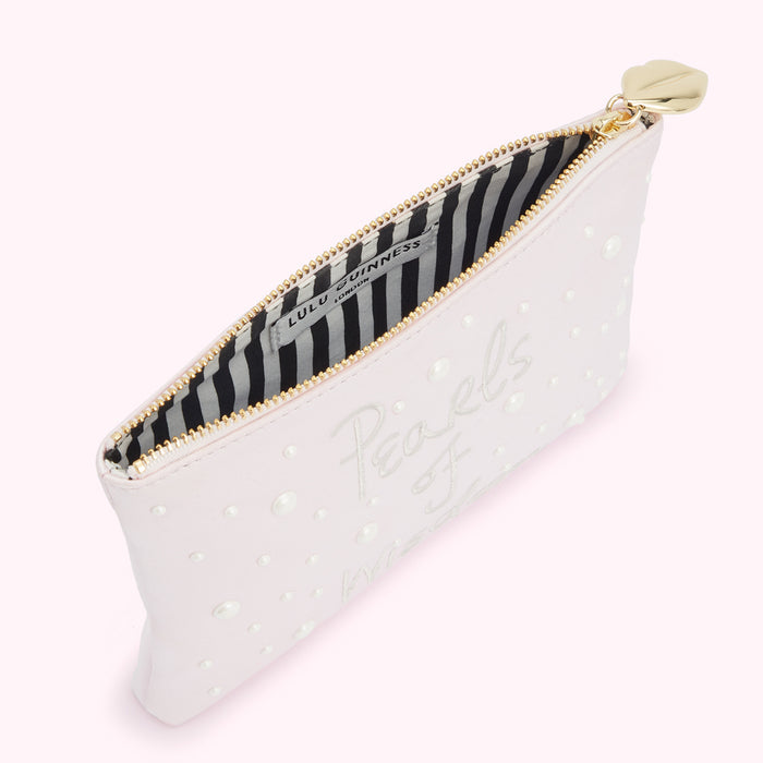 Pink Lulu Guinness zip-around pouch with pearls and "Pearls of Wisdom" embroidered on it.