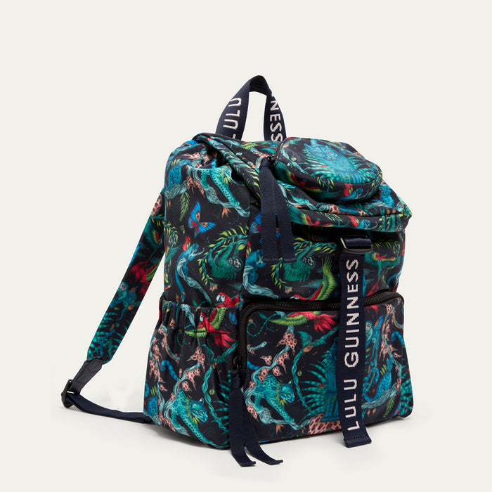 Colorful backpack  by Lulu Guinness x Emma Shipley with floral pattern and 'Lulu Guinness' branding on a white background
