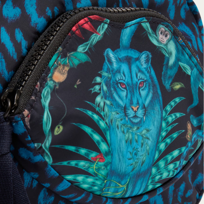 Close-up of a backpack with a blue panther design  by Lulu Guinness x Emma Shipley on a dark background
