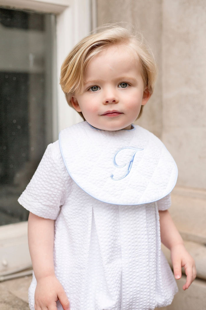 Boys Personalised White Seersucker Quilted Bib Trimmed With Blue