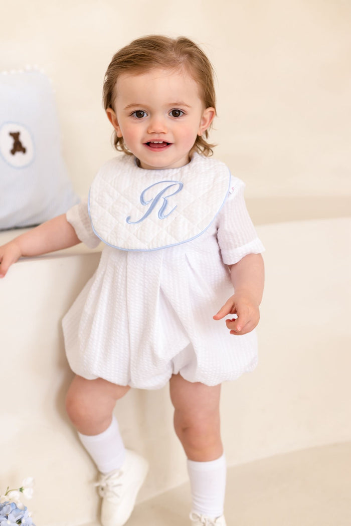 Boys Personalised White Seersucker Quilted Bib Trimmed With Blue