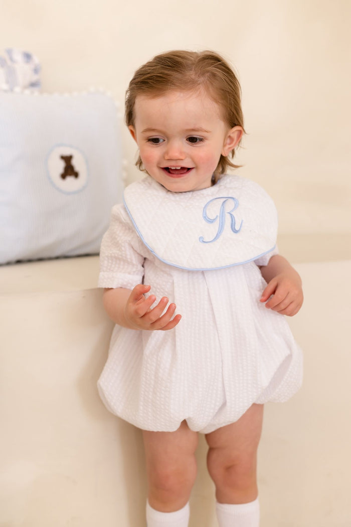 Boys Personalised White Seersucker Quilted Bib Trimmed With Blue