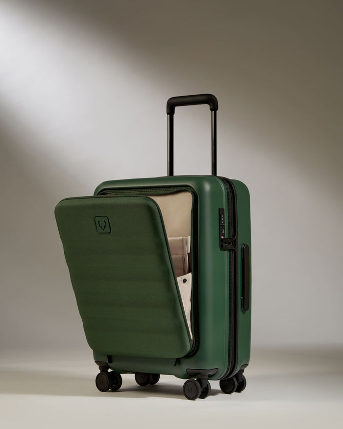 a green suitcase with wheels