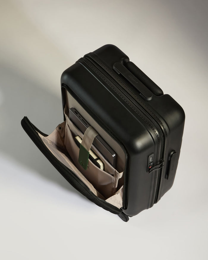 a black suitcase with a pocket inside