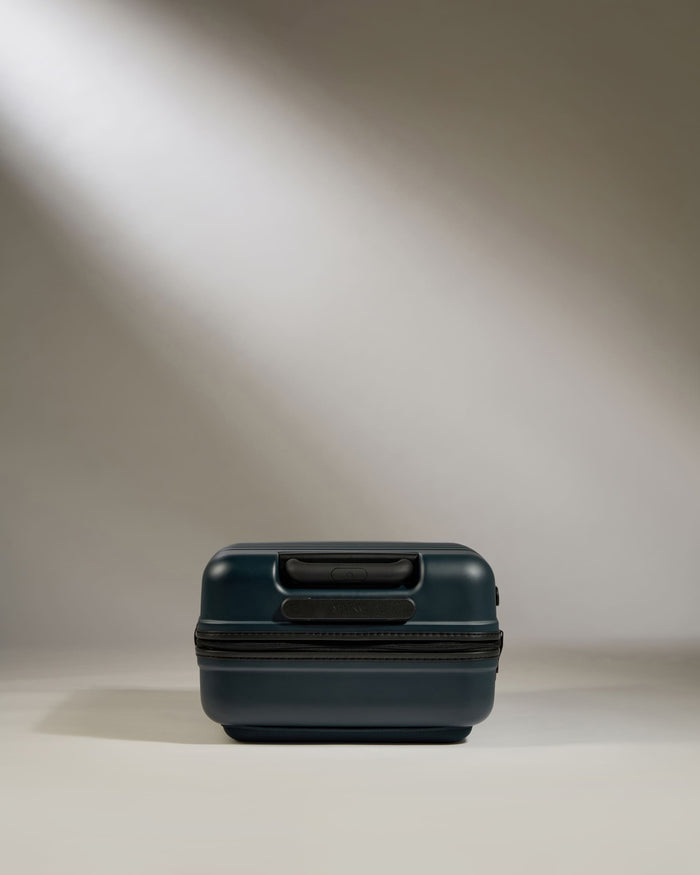 a black suitcase with a light shining on it