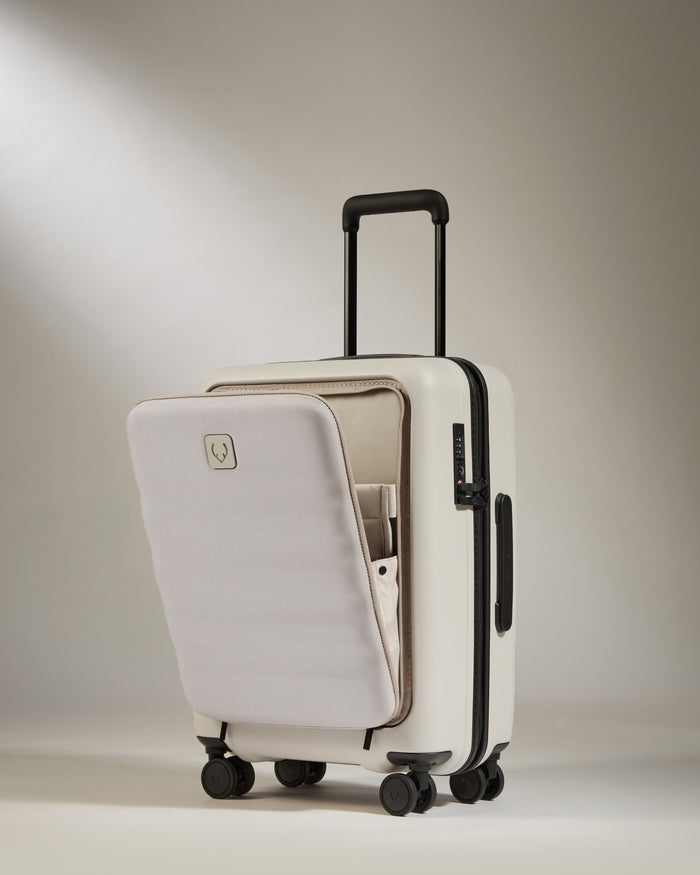 a white suitcase with a handle