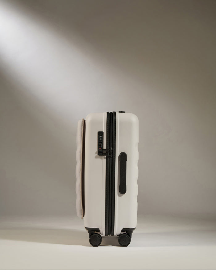 a white suitcase with wheels