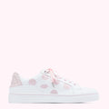 White leather sneakers with pink polka dots and lips, on a pink background.