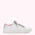 White leather low-top sneaker with black and white striped laces and a red leather accent.