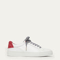 White sneaker with red heel and black and white striped laces on a white background