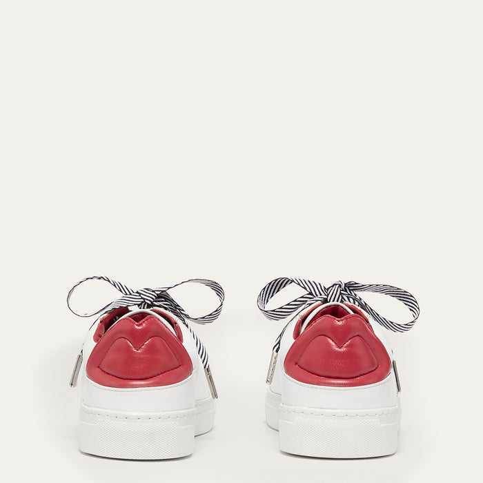 Back image of white trainers with red lip details on the backs on a white background