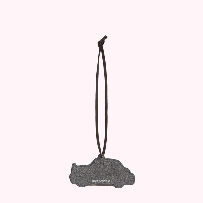 Grey felt car air freshener with brown cord hanging from a white background.