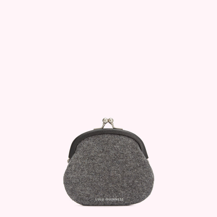 Grey Lulu Guinness felt purse with a silver clasp against a white background.