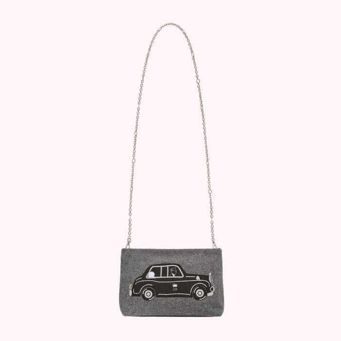 Grey felt crossbody bag with a black embroidered taxi cab design and a silver chain strap.
