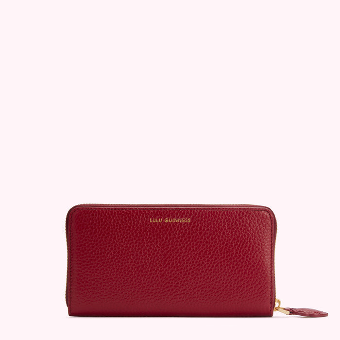 Red leather zip-around wallet by Lulu Guinness.