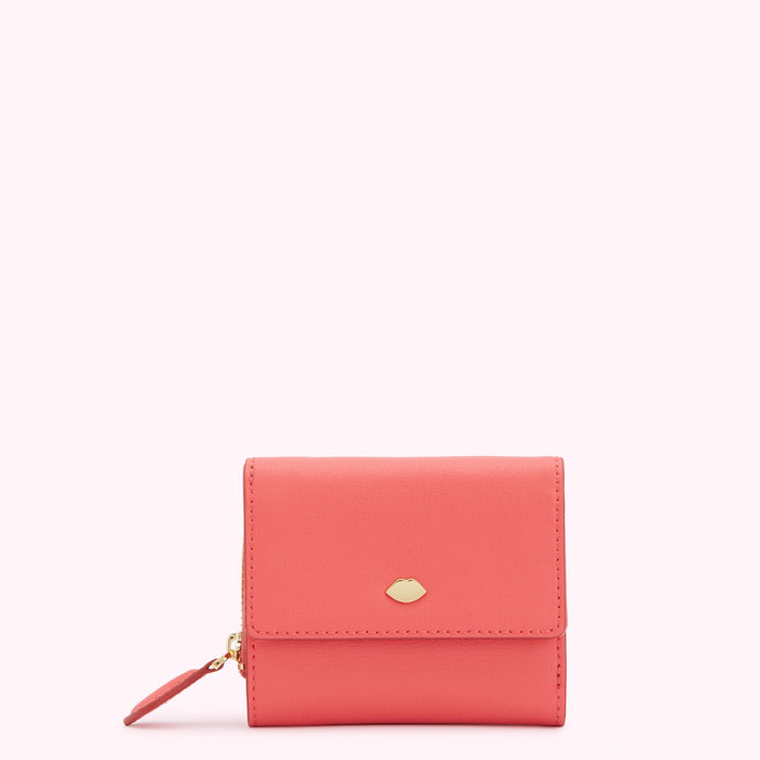 Coral pink leather wallet with gold lip detail.