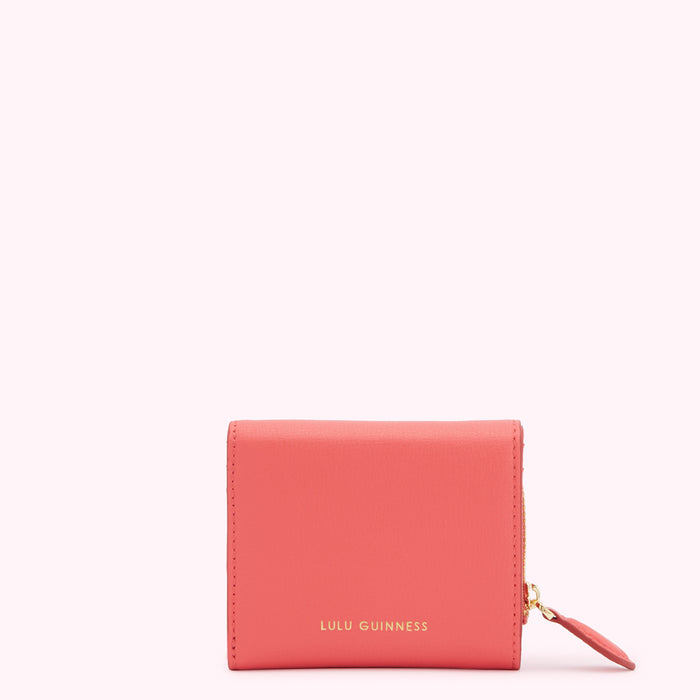 Coral Lulu Guinness wallet with gold zipper.