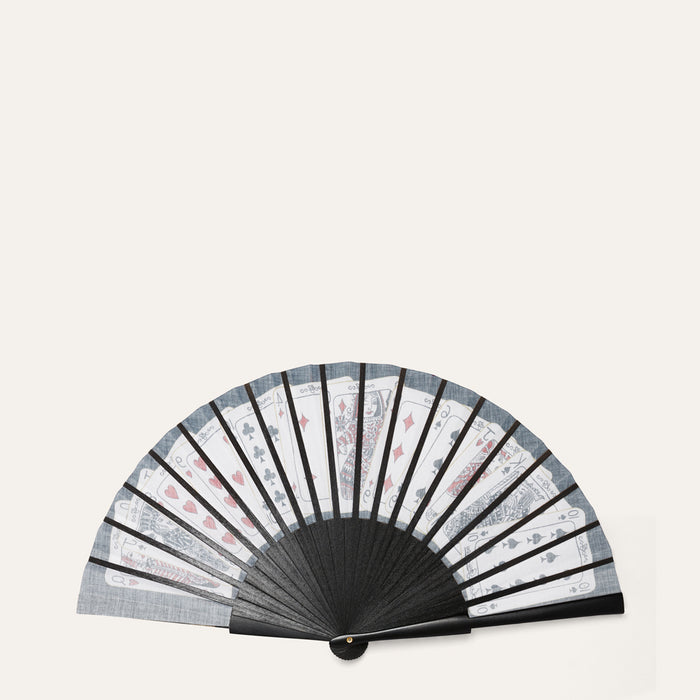 Black hand fan with patterned design on a white background