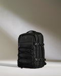 a black backpack with a light shining on it