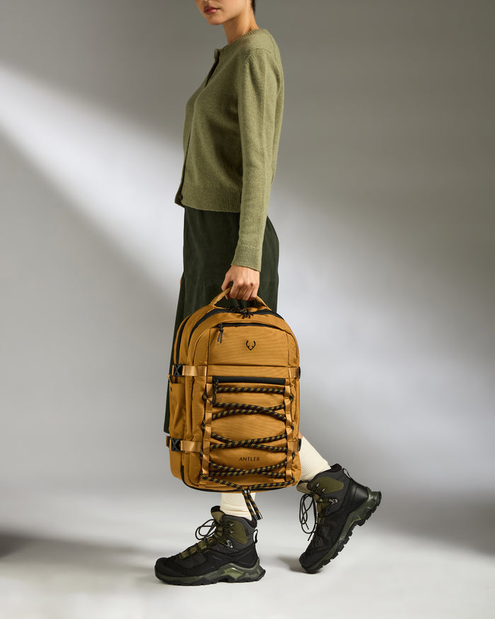 a woman holding a backpack