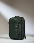 a green bag with straps