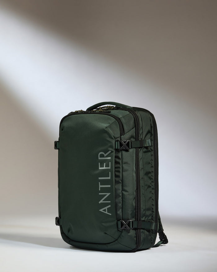 a green bag with straps