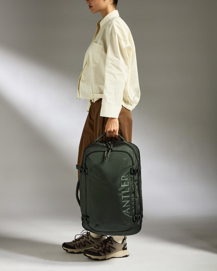a woman holding a suitcase