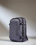 a grey backpack with black straps