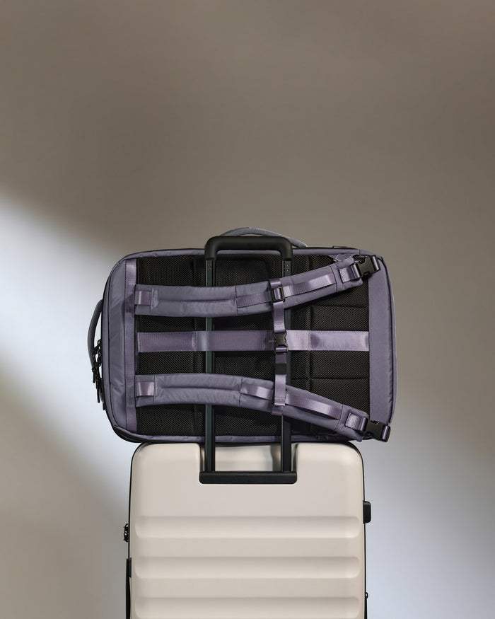 a luggage on top of a suitcase