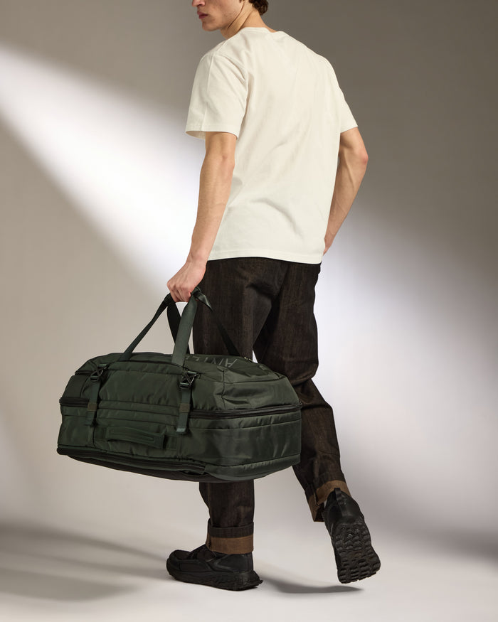 a man walking with a bag