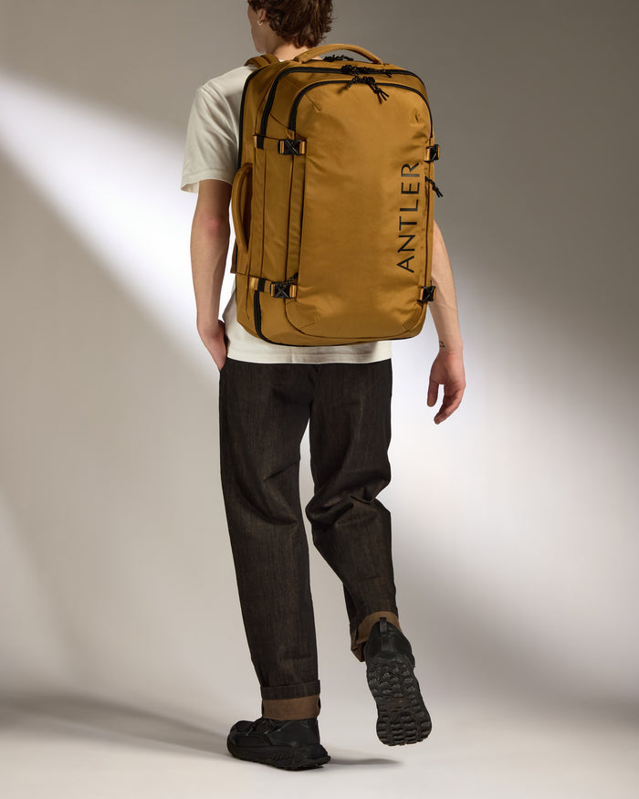 a man walking with a backpack