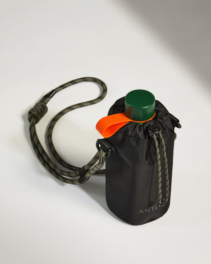a water bottle with a strap