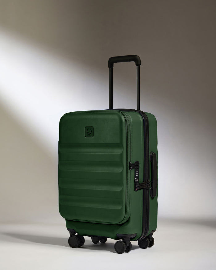 a green suitcase with wheels