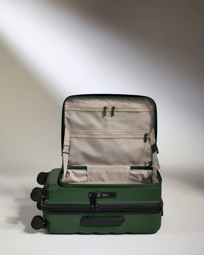 a green suitcase with wheels